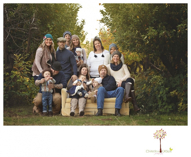 Sonora Family Photographer Christine Dibble Photography takes extended Fall family photos at Indigeny Reserve on a cream velvet loveseat sitting in the apple orchard.