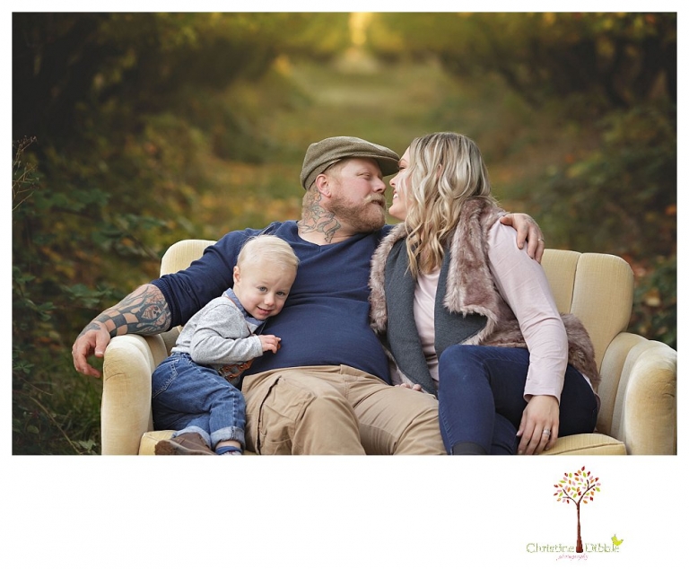 Sonora Family Photographer Christine Dibble Photography takes extended Fall family photos at Indigeny Reserve on a cream velvet loveseat sitting in the apple orchard.