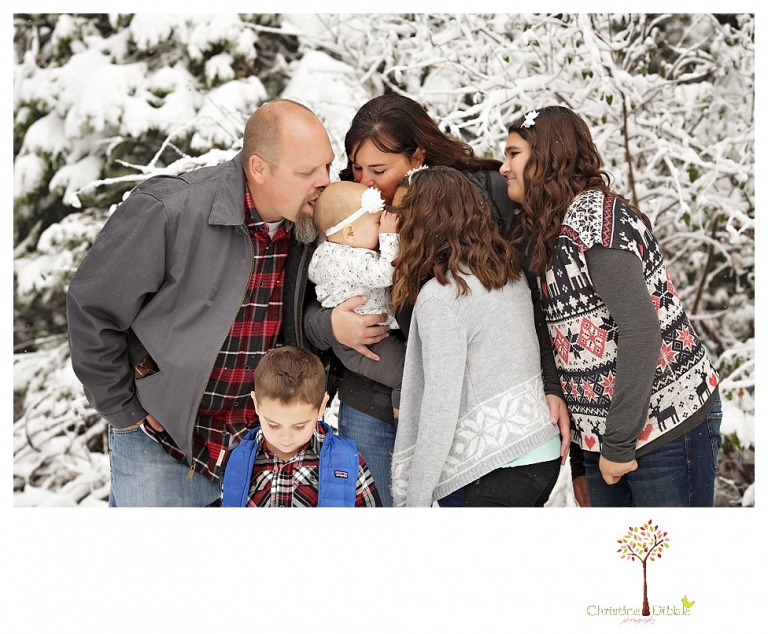 Sonora Family Photographer Christine Dibble Photography takes family portraits in the snow out of Long Barn during a big snowstorm.