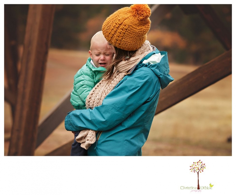 Sonora Family Photographer Christine Dibble Photography takes family portraits of an extended family on Thanksgiving weekend in a field in Twain Harte in snow flurries.