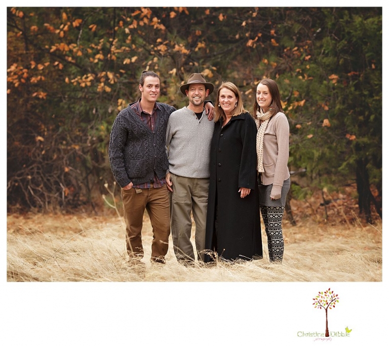 Sonora Family Photographer Christine Dibble Photography takes family portraits of an extended family on Thanksgiving weekend in a field in Twain Harte in snow flurries.