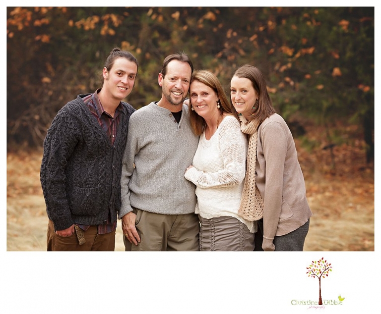 Sonora Family Photographer Christine Dibble Photography takes family portraits of an extended family on Thanksgiving weekend in a field in Twain Harte in snow flurries.