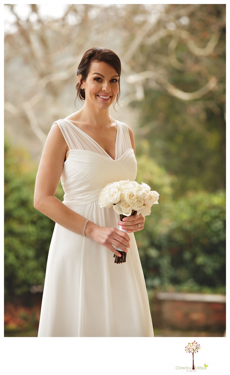 Sonora Wedding Photographer Christine Dibble Photography takes wedding portraits at an outdoor winter rainy wedding at the Tuolumne County Museum courtyard and Emberz restaurant.