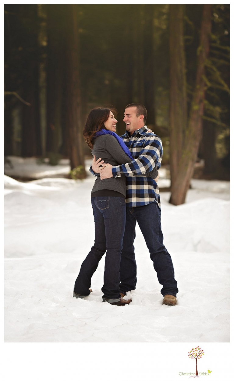 Sonora Engagement Photographer Christine Dibble Photography takes engagement photos in the snow on Valentine's Day at Pinecrest Lake as a couple laughs and throws snowballs for beautiful engagement portraits.