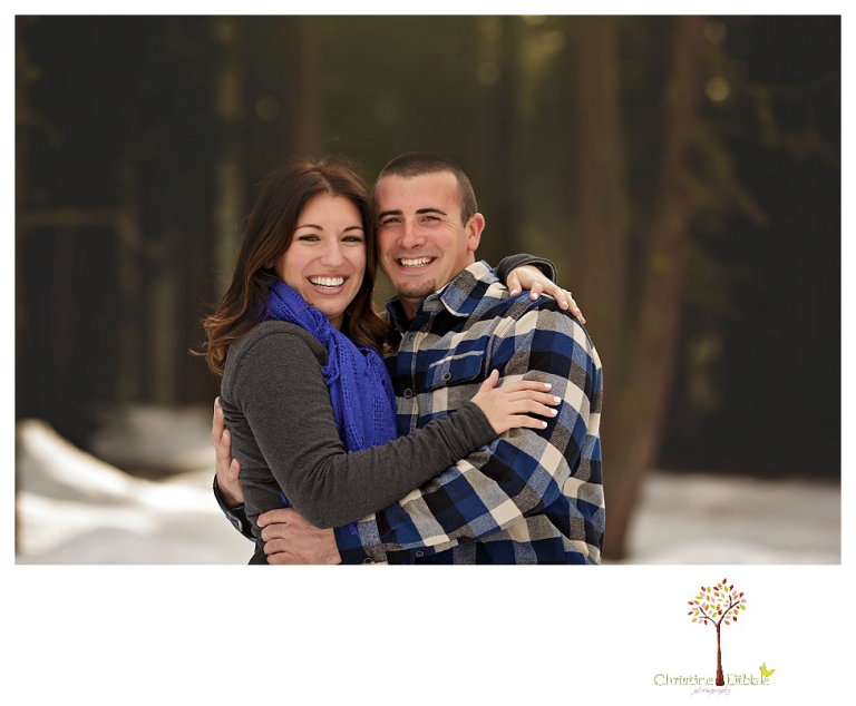 Sonora Engagement Photographer Christine Dibble Photography takes engagement photos in the snow on Valentine's Day at Pinecrest Lake as a couple laughs and throws snowballs for beautiful engagement portraits.