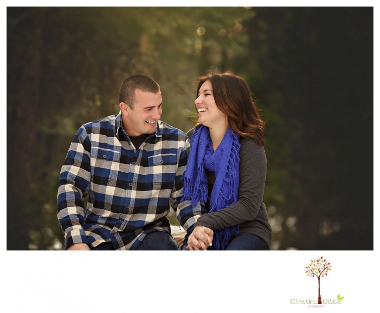 Sonora Engagement Photographer Christine Dibble Photography takes engagement photos in the snow on Valentine's Day at Pinecrest Lake as a couple laughs and throws snowballs for beautiful engagement portraits.