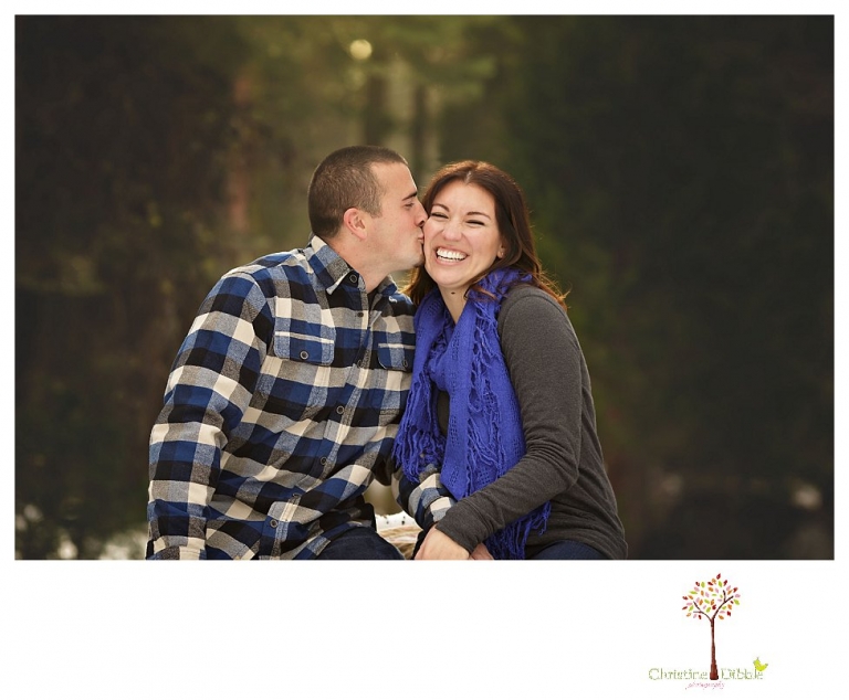 Sonora Engagement Photographer Christine Dibble Photography takes engagement photos in the snow on Valentine's Day at Pinecrest Lake as a couple laughs and throws snowballs for beautiful engagement portraits.