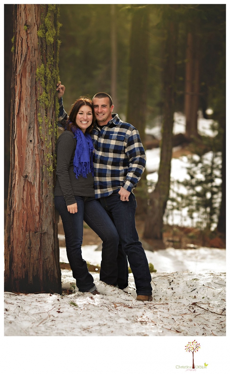 Sonora Engagement Photographer Christine Dibble Photography takes engagement photos in the snow on Valentine's Day at Pinecrest Lake as a couple laughs and throws snowballs for beautiful engagement portraits.