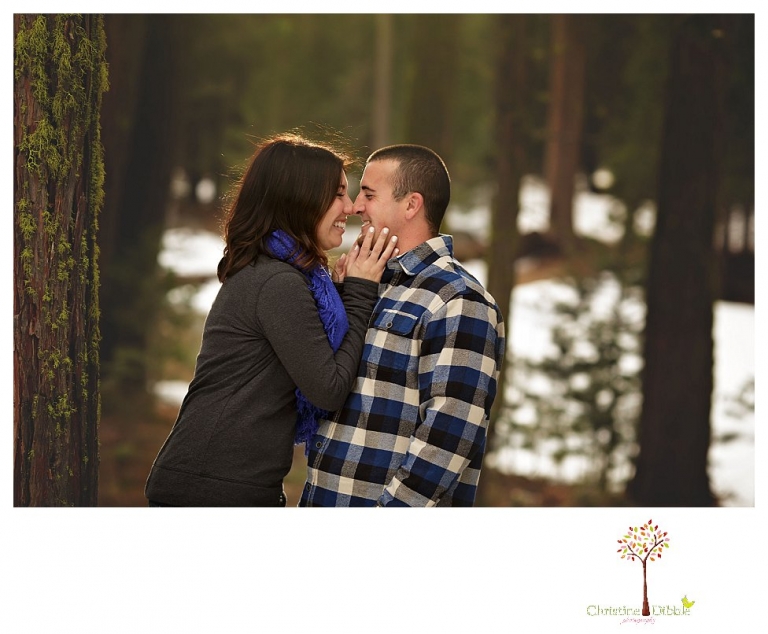 Sonora Engagement Photographer Christine Dibble Photography takes engagement photos in the snow on Valentine's Day at Pinecrest Lake as a couple laughs and throws snowballs for beautiful engagement portraits.