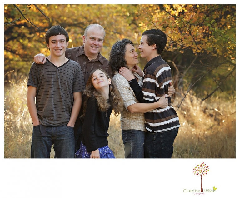 Sonora Family Photographer Christine Dibble Photography takes family portraits in Twain Harte of a family with an autistic child as they pose and play.