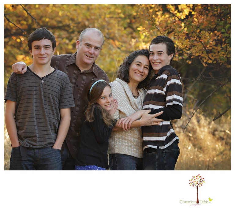 Sonora Family Photographer Christine Dibble Photography takes family portraits in Twain Harte of a family with an autistic child as they pose and play.