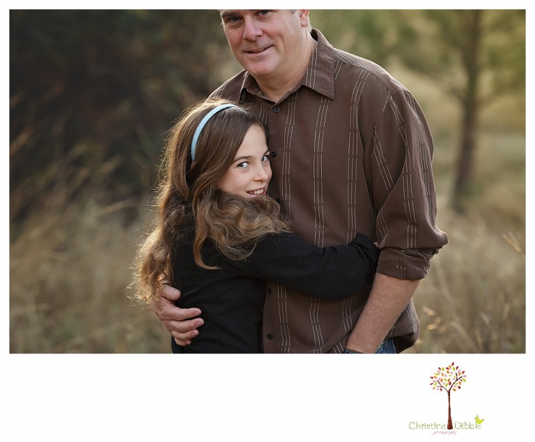 Sonora Family Photographer Christine Dibble Photography takes family portraits in Twain Harte of a family with an autistic child as they pose and play.