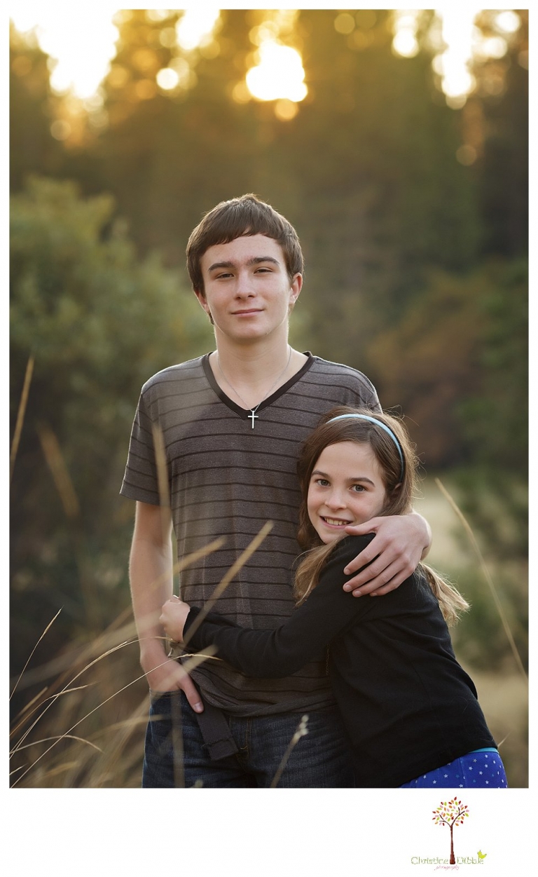 Sonora Family Photographer Christine Dibble Photography takes family portraits in Twain Harte of a family with an autistic child as they pose and play.