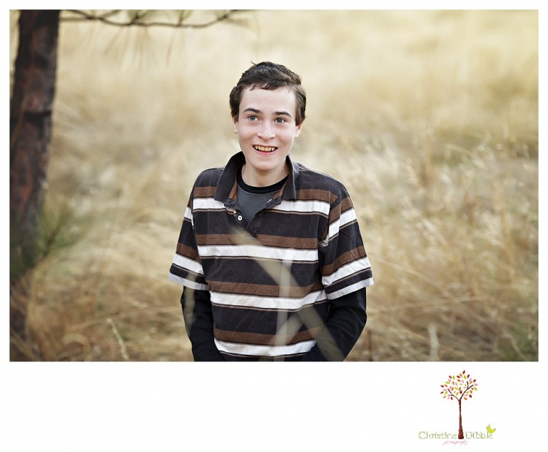 Sonora Family Photographer Christine Dibble Photography takes family portraits in Twain Harte of a family with an autistic child as they pose and play.
