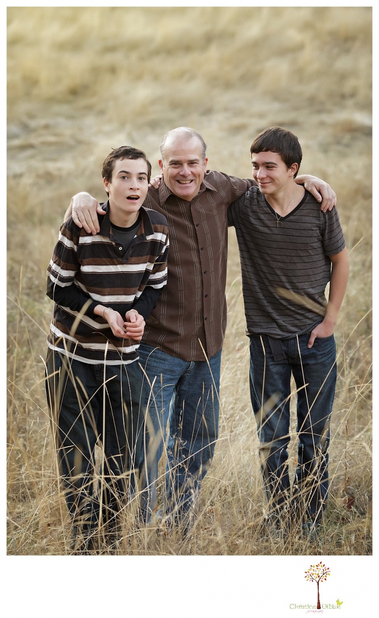 Sonora Family Photographer Christine Dibble Photography takes family portraits in Twain Harte of a family with an autistic child as they pose and play.
