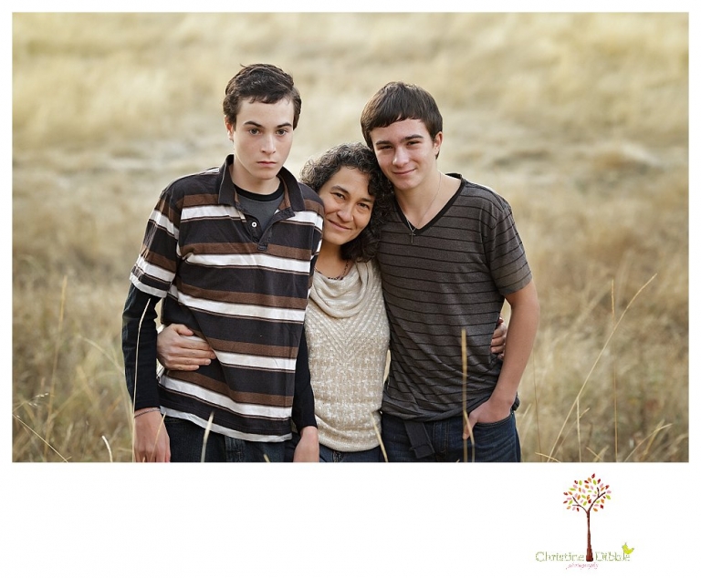 Sonora Family Photographer Christine Dibble Photography takes family portraits in Twain Harte of a family with an autistic child as they pose and play.