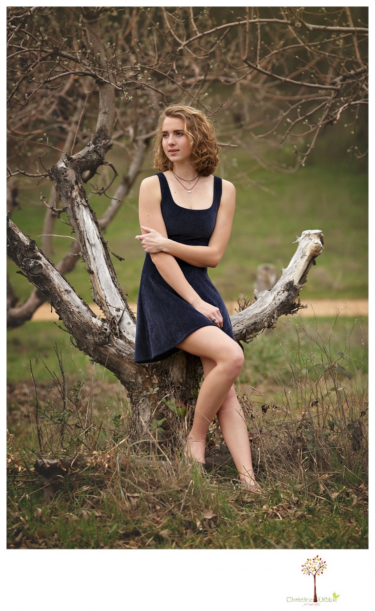 Sonora Senior Portrait photographer Christine Dibble Photography takes outdoor spring senior portraits at Indigeny Reserve of a girl in natural settings and with favorite books.