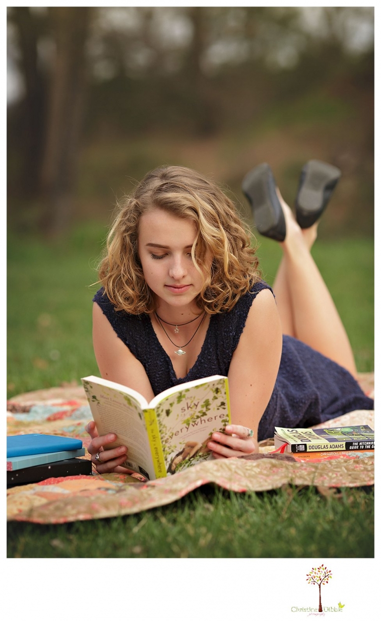 Sonora Senior Portrait photographer Christine Dibble Photography takes outdoor spring senior portraits at Indigeny Reserve of a girl in natural settings and with favorite books.