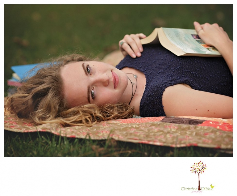 Sonora Senior Portrait photographer Christine Dibble Photography takes outdoor spring senior portraits at Indigeny Reserve of a girl in natural settings and with favorite books.