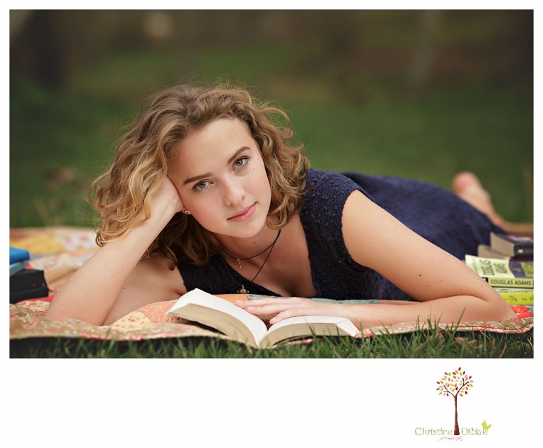 Sonora Senior Portrait photographer Christine Dibble Photography takes outdoor spring senior portraits at Indigeny Reserve of a girl in natural settings and with favorite books.