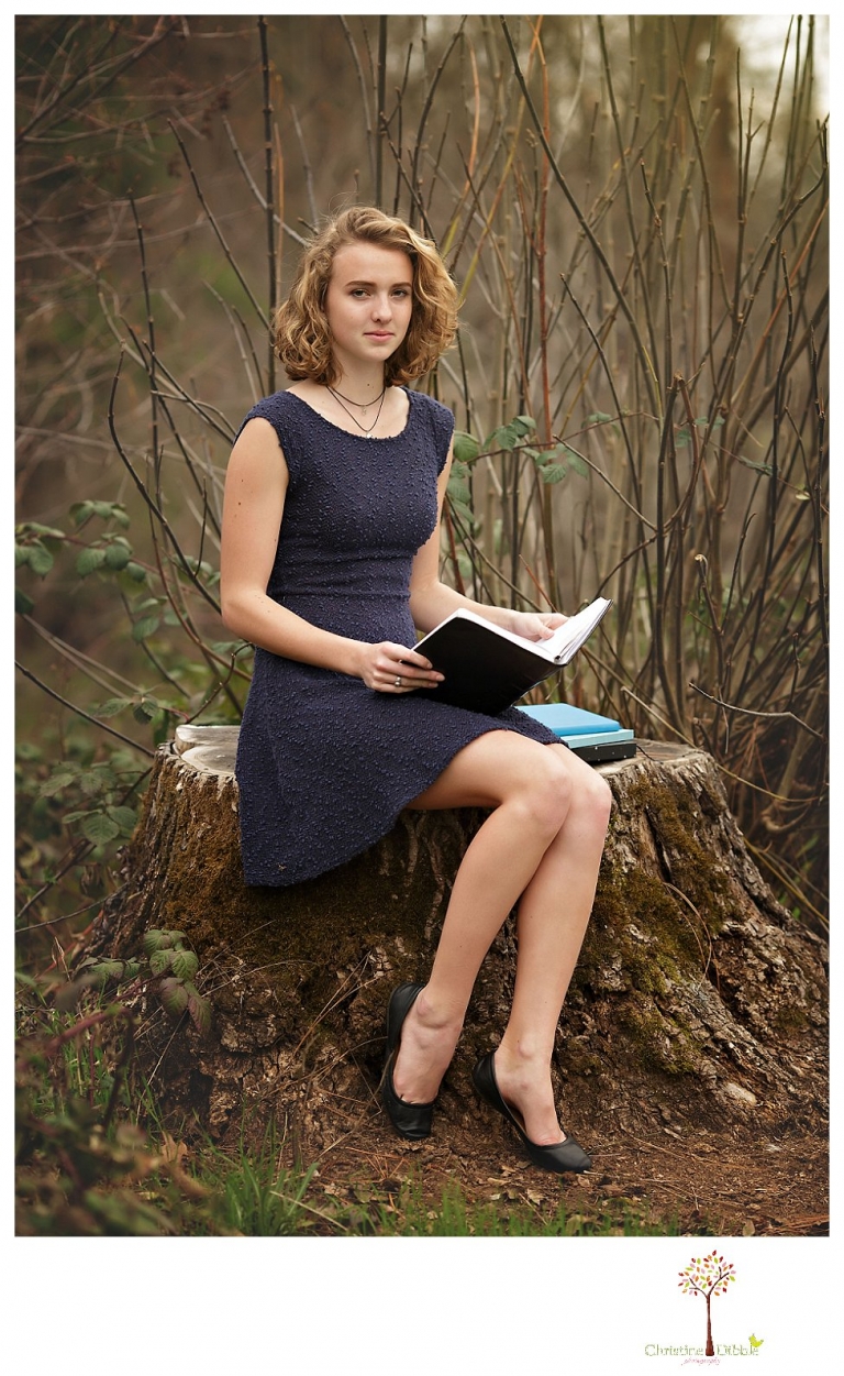 Sonora Senior Portrait photographer Christine Dibble Photography takes outdoor spring senior portraits at Indigeny Reserve of a girl in natural settings and with favorite books.