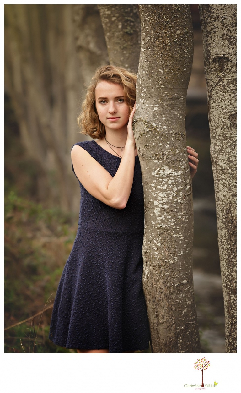 Sonora Senior Portrait photographer Christine Dibble Photography takes outdoor spring senior portraits at Indigeny Reserve of a girl in natural settings and with favorite books.