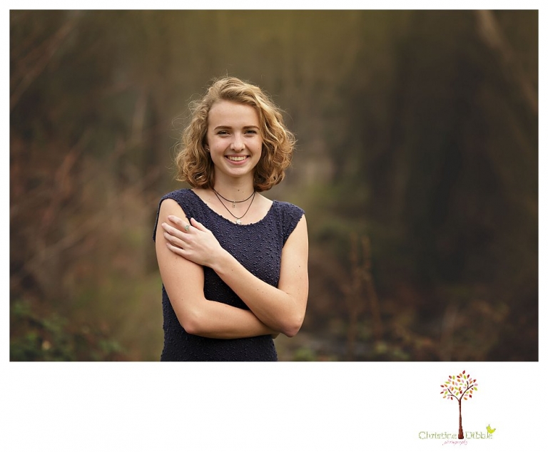 Sonora Senior Portrait photographer Christine Dibble Photography takes outdoor spring senior portraits at Indigeny Reserve of a girl in natural settings and with favorite books.