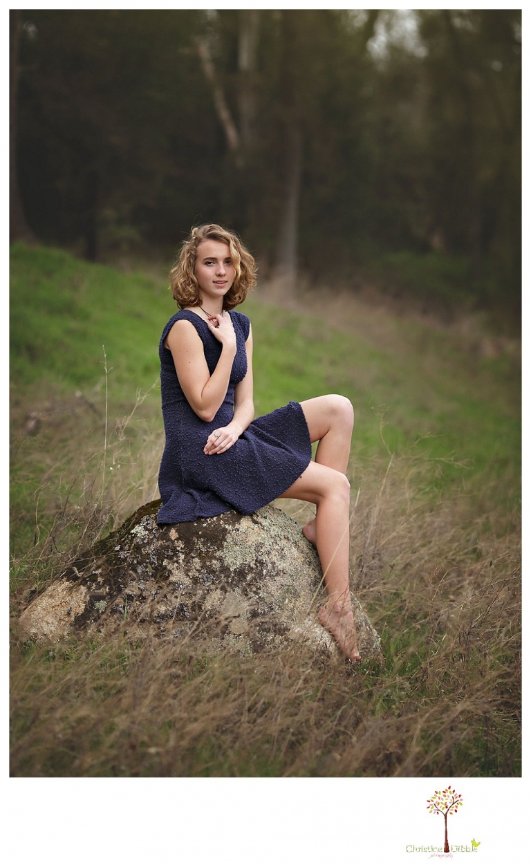 Sonora Senior Portrait photographer Christine Dibble Photography takes outdoor spring senior portraits at Indigeny Reserve of a girl in natural settings and with favorite books.