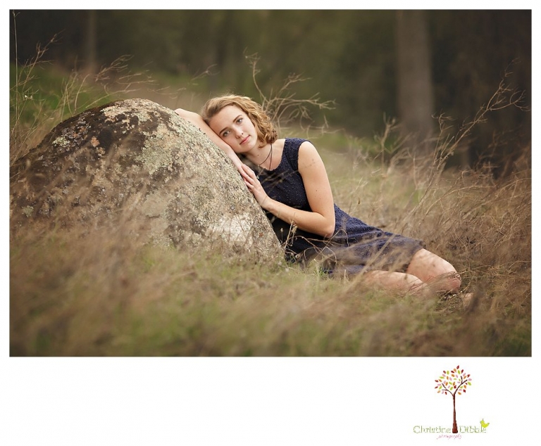 Sonora Senior Portrait photographer Christine Dibble Photography takes outdoor spring senior portraits at Indigeny Reserve of a girl in natural settings and with favorite books.