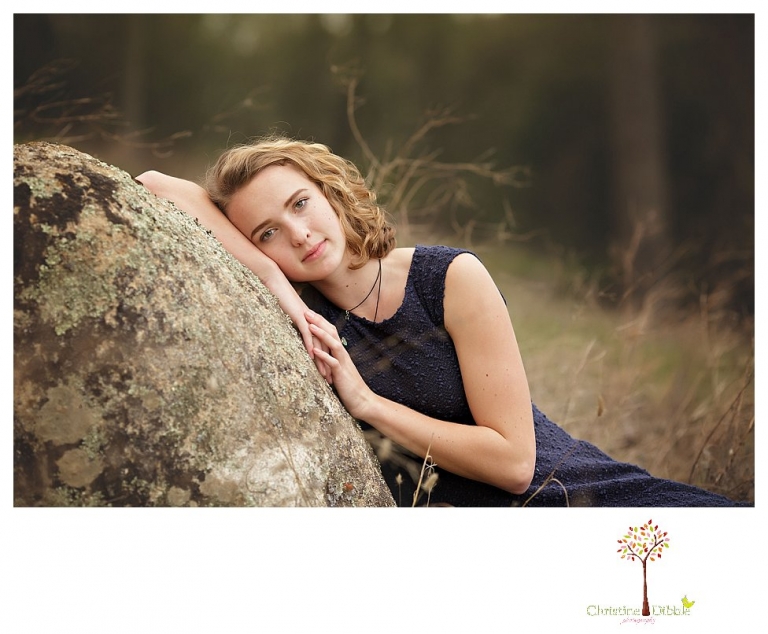 Sonora Senior Portrait photographer Christine Dibble Photography takes outdoor spring senior portraits at Indigeny Reserve of a girl in natural settings and with favorite books.