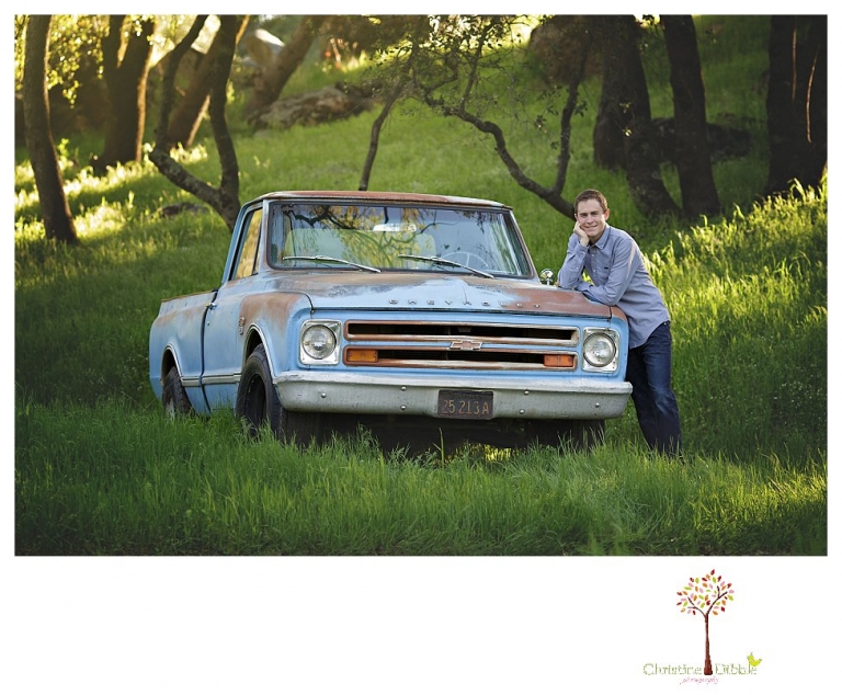Sonora High senior portrait photographer Christine Dibble Photography takes outdoor spring senior portraits of a track star in his yard with his letterman jacket and old Chevy truck.