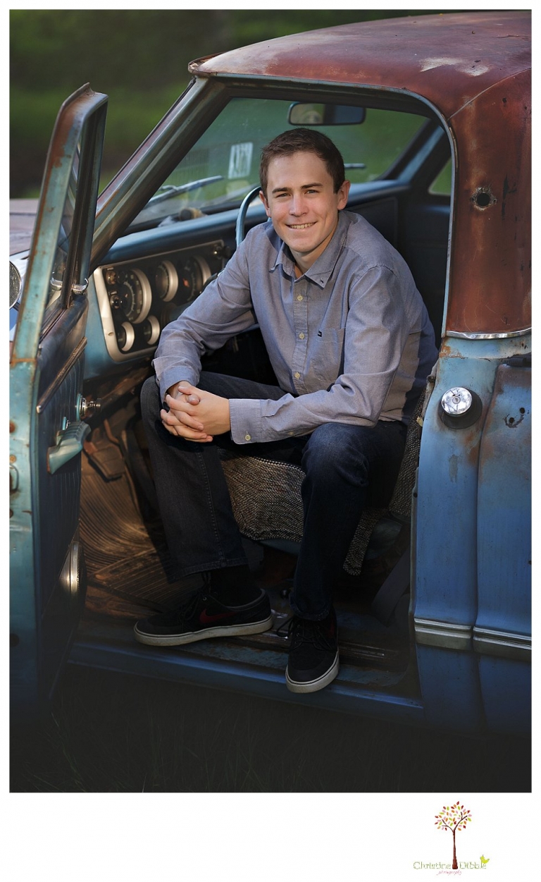 Sonora High senior portrait photographer Christine Dibble Photography takes outdoor spring senior portraits of a track star in his yard with his letterman jacket and old Chevy truck.
