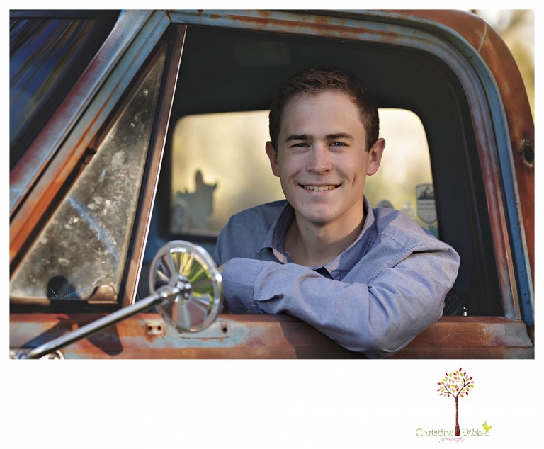 Sonora High senior portrait photographer Christine Dibble Photography takes outdoor spring senior portraits of a track star in his yard with his letterman jacket and old Chevy truck.