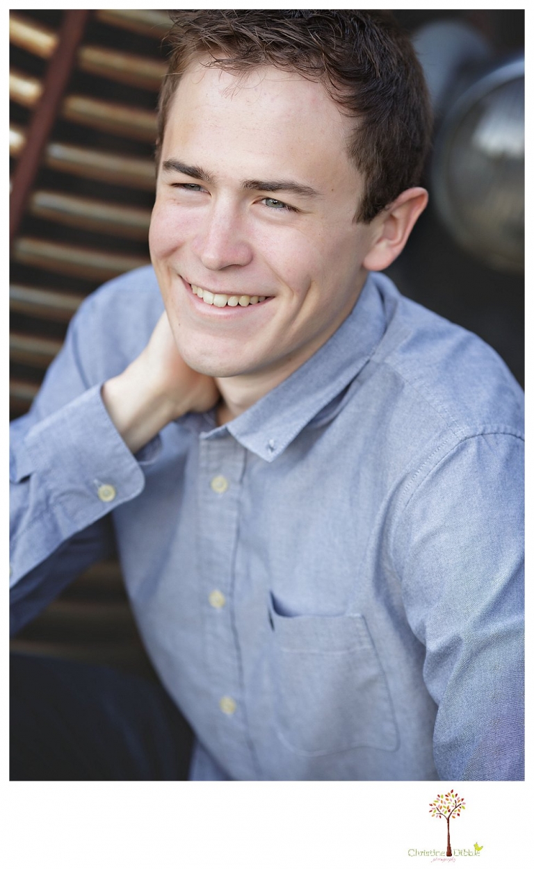 Sonora High senior portrait photographer Christine Dibble Photography takes outdoor spring senior portraits of a track star in his yard with his letterman jacket and old Chevy truck.