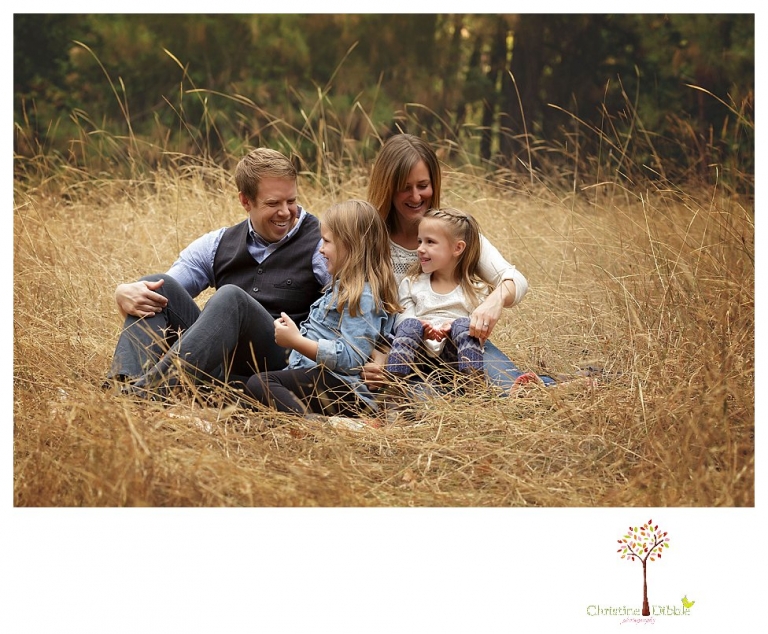 Sonora Family Photographer Christine Dibble Photography takes fall family portraits of a family with two little girls in both formal poses and while they hunt for ladybugs.