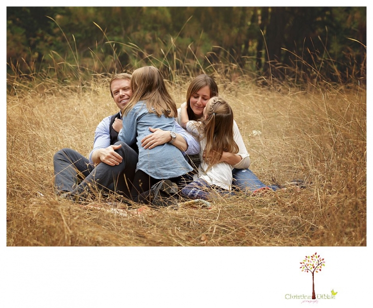 Sonora Family Photographer Christine Dibble Photography takes fall family portraits of a family with two little girls in both formal poses and while they hunt for ladybugs.