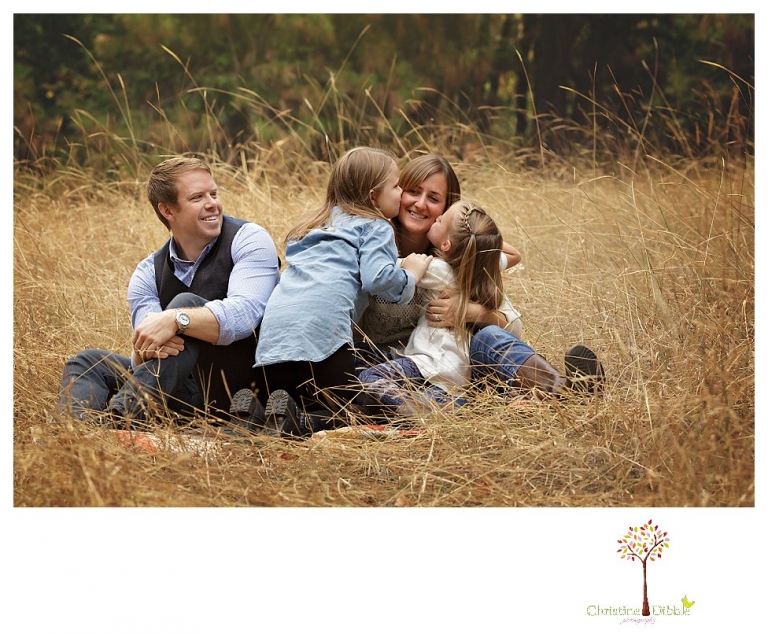 Sonora Family Photographer Christine Dibble Photography takes fall family portraits of a family with two little girls in both formal poses and while they hunt for ladybugs.