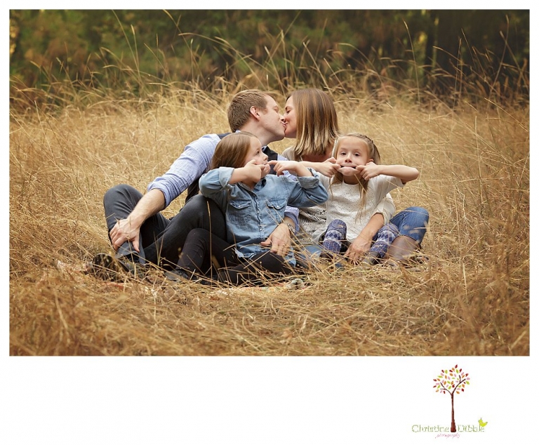 Sonora Family Photographer Christine Dibble Photography takes fall family portraits of a family with two little girls in both formal poses and while they hunt for ladybugs.