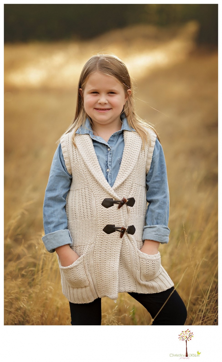 Sonora Family Photographer Christine Dibble Photography takes fall family portraits of a family with two little girls in both formal poses and while they hunt for ladybugs.