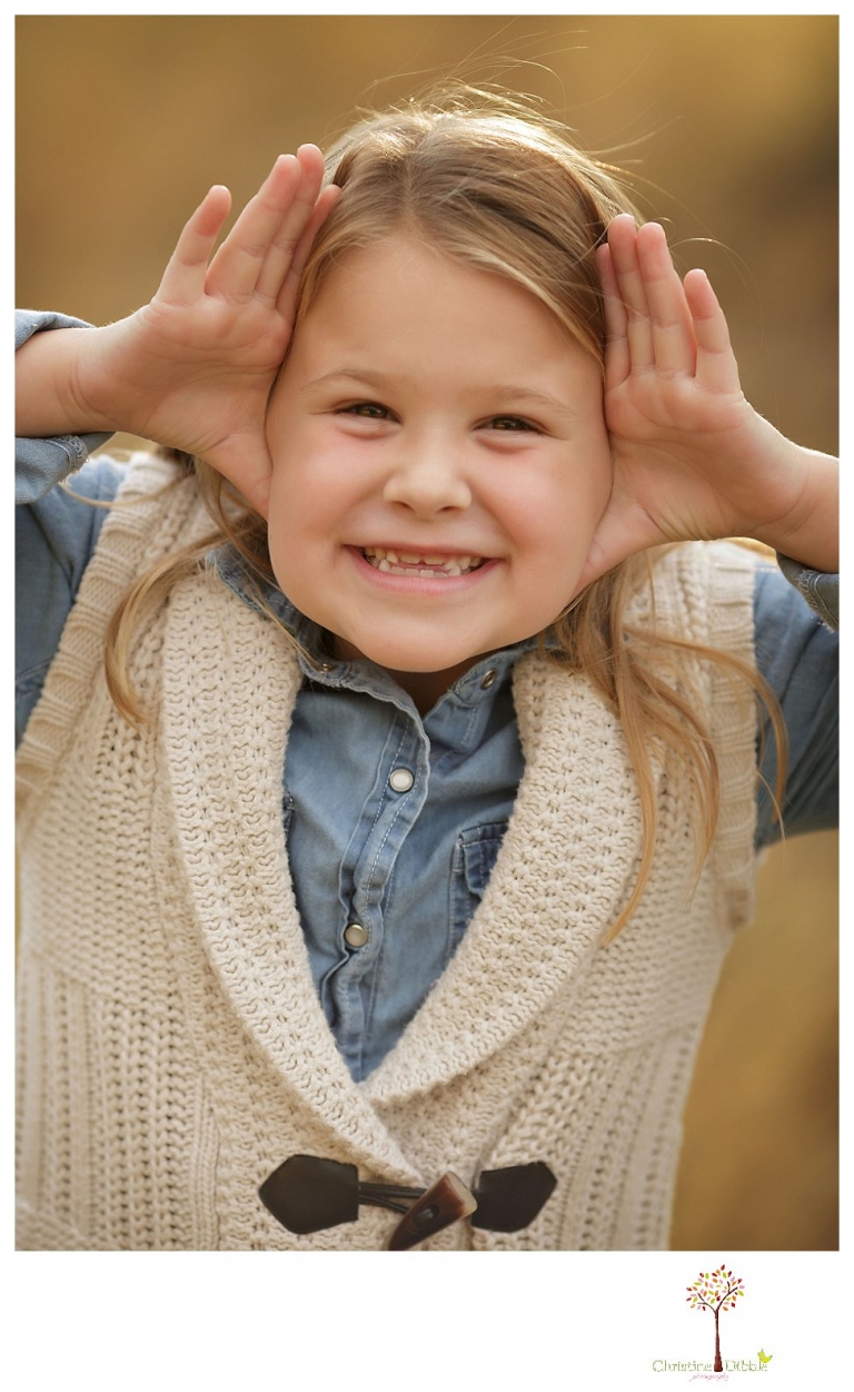 Sonora Family Photographer Christine Dibble Photography takes fall family portraits of a family with two little girls in both formal poses and while they hunt for ladybugs.