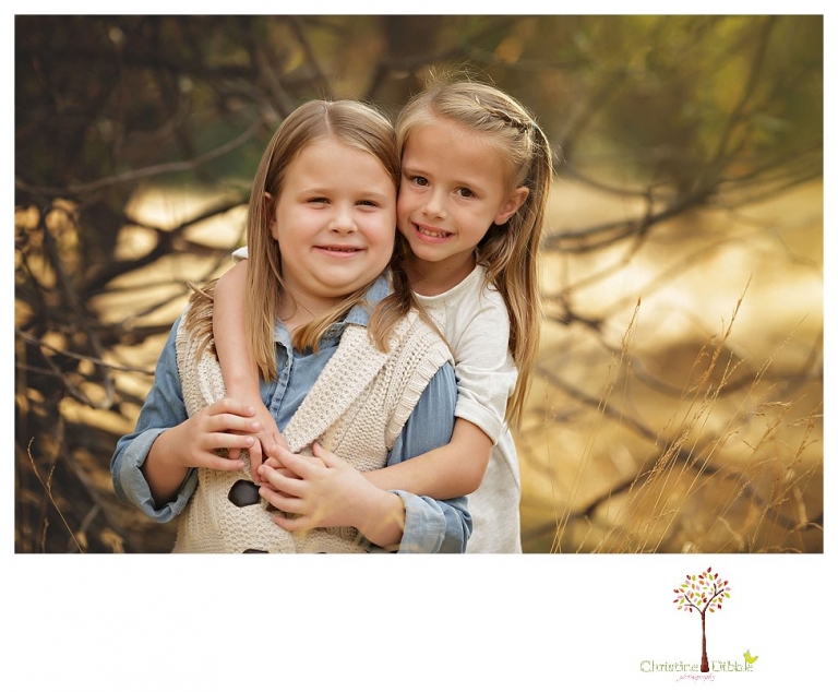 Sonora Family Photographer Christine Dibble Photography takes fall family portraits of a family with two little girls in both formal poses and while they hunt for ladybugs.