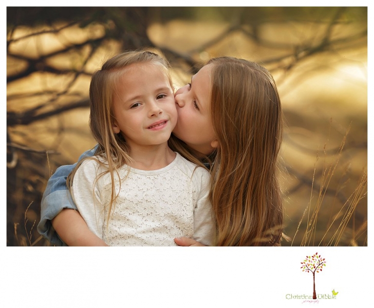 Sonora Family Photographer Christine Dibble Photography takes fall family portraits of a family with two little girls in both formal poses and while they hunt for ladybugs.