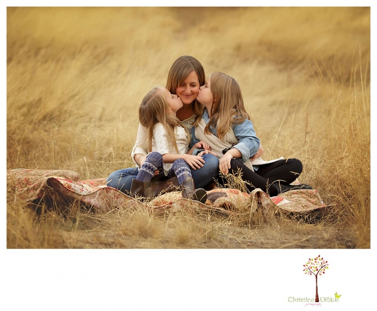 Sonora Family Photographer Christine Dibble Photography takes fall family portraits of a family with two little girls in both formal poses and while they hunt for ladybugs.