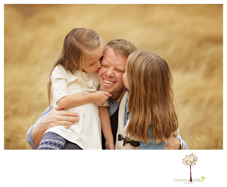 Sonora Family Photographer Christine Dibble Photography takes fall family portraits of a family with two little girls in both formal poses and while they hunt for ladybugs.