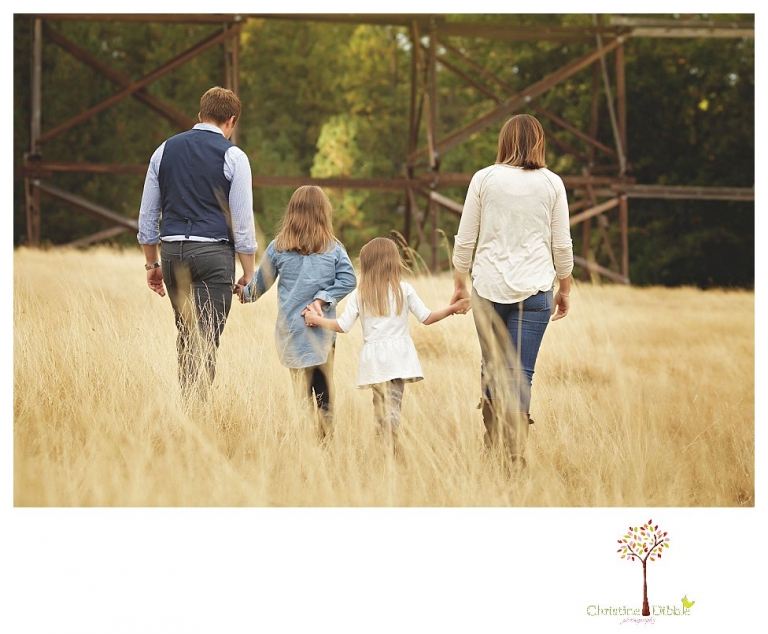 Sonora Family Photographer Christine Dibble Photography takes fall family portraits of a family with two little girls in both formal poses and while they hunt for ladybugs.