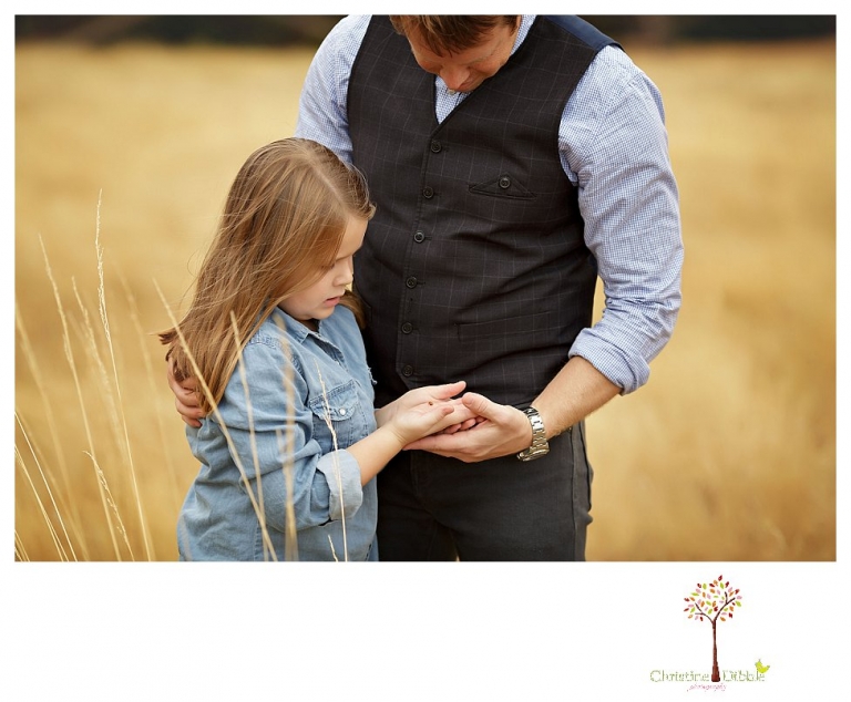 Sonora Family Photographer Christine Dibble Photography takes fall family portraits of a family with two little girls in both formal poses and while they hunt for ladybugs.