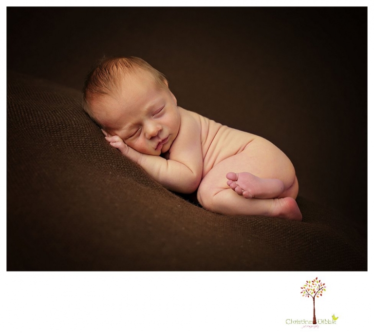 Newborn photography by Sonora Newborn Photographer Christine Dibble Photography takes place in her Sonora studio with poses on blankets and in vintage props.
