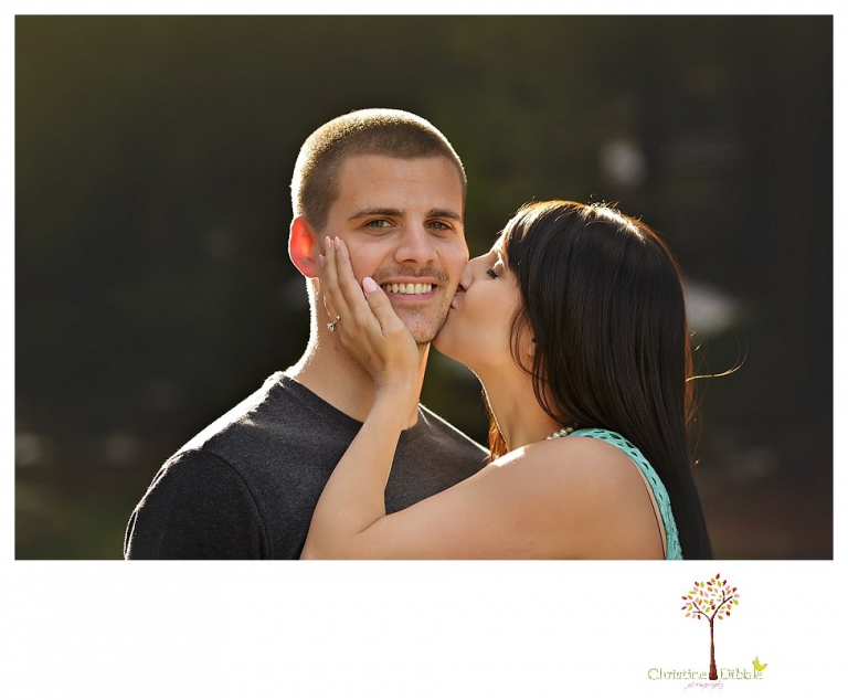 Sonora engagement and wedding photographer Christine Dibble Photography takes engagement photos of a couple in the woods at Pinecrest as they dance on a stump and walk through the trails. 