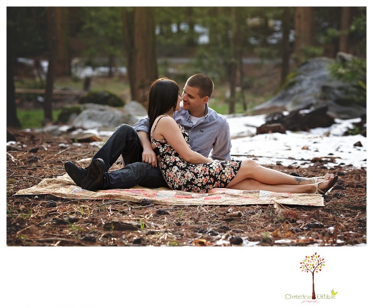 Sonora engagement and wedding photographer Christine Dibble Photography takes engagement photos of a couple in the woods at Pinecrest as they dance on a stump and walk through the trails. 