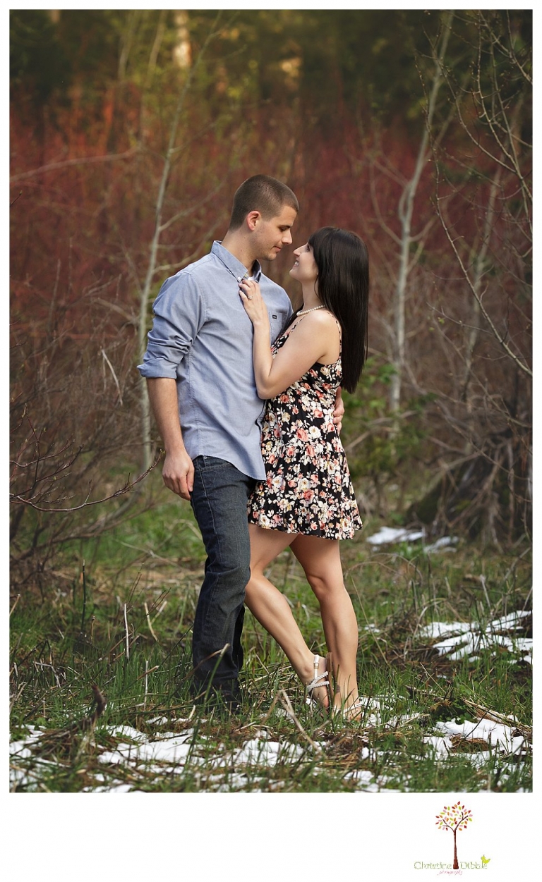 Sonora engagement and wedding photographer Christine Dibble Photography takes engagement photos of a couple in the woods at Pinecrest as they dance on a stump and walk through the trails. 